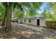 Backyard featuring a brick home exterior with a stone patio at 3180 Rehoboth Dr, Decatur, GA 30033