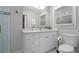 Bright bathroom featuring white vanity with drawers, tile floors, and a window at 3180 Rehoboth Dr, Decatur, GA 30033