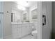 Bright bathroom featuring white vanity with drawers, tile floors, and a window at 3180 Rehoboth Dr, Decatur, GA 30033