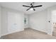 Bedroom with large closet, neutral walls, carpet flooring, and natural light from the window at 3180 Rehoboth Dr, Decatur, GA 30033