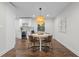 Cozy dining area features hardwood floors, neutral paint, modern lighting, and a large window at 3180 Rehoboth Dr, Decatur, GA 30033