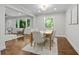 Bright dining room featuring hardwood floors, neutral paint, and large window offers ample natural light at 3180 Rehoboth Dr, Decatur, GA 30033