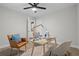 Bright office space featuring chairs, a desk, and a ceiling fan at 3180 Rehoboth Dr, Decatur, GA 30033