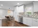 Bright eat-in kitchen featuring white cabinets, granite countertops, and stainless steel appliances at 3180 Rehoboth Dr, Decatur, GA 30033