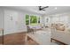 Bright living room featuring hardwood floors, neutral paint, ceiling fan and large windows offering ample natural light at 3180 Rehoboth Dr, Decatur, GA 30033