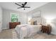 Comfortable main bedroom featuring a ceiling fan, natural light and neutral decor at 3180 Rehoboth Dr, Decatur, GA 30033