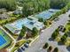 Aerial view of neighborhood clubhouse and pool with tennis and play courts at 388 Golf Crest Dr, Acworth, GA 30101