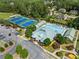 Aerial view of the community clubhouse with pool and tennis courts amid lush landscaping at 388 Golf Crest Dr, Acworth, GA 30101