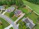 Aerial view of home, golf course and playground in a lush, green neighborhood at 388 Golf Crest Dr, Acworth, GA 30101