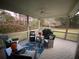 Relaxing back porch with outdoor seating and views of the serene backyard at 388 Golf Crest Dr, Acworth, GA 30101