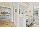 Large dressing area with a makeup table in the owner's bathroom suite at 388 Golf Crest Dr, Acworth, GA 30101