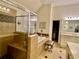 Serene bathroom with a walk-in shower, a soaking tub, and tiled floor at 388 Golf Crest Dr, Acworth, GA 30101