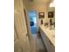 Bright bathroom with double sinks, white cabinets, and a view to a bedroom at 388 Golf Crest Dr, Acworth, GA 30101
