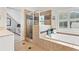 Bathroom featuring a soaking tub, glass enclosed shower, and neutral tile at 388 Golf Crest Dr, Acworth, GA 30101