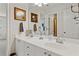 Bright bathroom featuring a double vanity, white cabinetry, and modern fixtures and decor at 388 Golf Crest Dr, Acworth, GA 30101