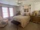 Cozy bedroom with natural light, including chair, bench, and curtains at 388 Golf Crest Dr, Acworth, GA 30101