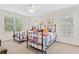 Bedroom featuring two twin beds, neutral walls, and natural light at 388 Golf Crest Dr, Acworth, GA 30101
