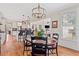 Cozy breakfast nook with hardwood floors, pendant lighting, and views of the living room and kitchen at 388 Golf Crest Dr, Acworth, GA 30101