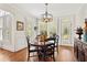 Charming breakfast nook with hardwood floors, pendant lighting, and views of the landscaped yard at 388 Golf Crest Dr, Acworth, GA 30101