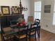 Cozy dining room featuring hardwood floors and a classic chandelier at 388 Golf Crest Dr, Acworth, GA 30101