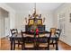 Elegant dining room with hardwood floors, decorative lighting, and a dining table at 388 Golf Crest Dr, Acworth, GA 30101