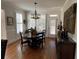 Elegant dining room with hardwood floors, chandelier, and natural light at 388 Golf Crest Dr, Acworth, GA 30101