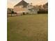 Charming two-story home with a beautifully landscaped yard and a wooden fence at 388 Golf Crest Dr, Acworth, GA 30101