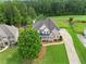 Beautiful aerial view of a home surrounded by lush greenery, golf course, and a playground at 388 Golf Crest Dr, Acworth, GA 30101