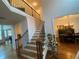 Bright foyer featuring hardwood floors, staircase, and an open view of the dining room at 388 Golf Crest Dr, Acworth, GA 30101