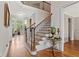 Elegant foyer with hardwood floors, staircase with iron railings, and stylish decor at 388 Golf Crest Dr, Acworth, GA 30101