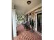 Welcoming front porch features brick flooring, rocking chairs, and classic decor at 388 Golf Crest Dr, Acworth, GA 30101