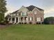 Charming two-story brick home with a manicured lawn and welcoming front porch at 388 Golf Crest Dr, Acworth, GA 30101