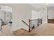 Bright hallway featuring neutral walls, carpet flooring, and views into a living area at 388 Golf Crest Dr, Acworth, GA 30101