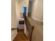 Hallway features carpet, wooden stairs, and neutral paint at 388 Golf Crest Dr, Acworth, GA 30101