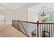 Second-floor hallway with classic trim, a decorative chandelier, and carpet flooring at 388 Golf Crest Dr, Acworth, GA 30101