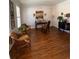 Inviting home office space with hardwood floors and three wicker chairs at 388 Golf Crest Dr, Acworth, GA 30101