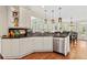 Kitchen featuring white cabinets, granite countertops, stainless steel appliances, and natural light at 388 Golf Crest Dr, Acworth, GA 30101