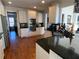 Modern kitchen with granite countertops, stainless steel appliances, and white cabinets at 388 Golf Crest Dr, Acworth, GA 30101