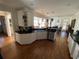Open-concept kitchen with stainless steel appliances, granite countertops, and hardwood floors at 388 Golf Crest Dr, Acworth, GA 30101