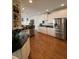 Traditional kitchen with white cabinetry, stainless steel appliances, and dark granite countertops at 388 Golf Crest Dr, Acworth, GA 30101