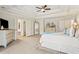 Large main bedroom with a sitting area, tray ceilings, and ensuite bathroom at 388 Golf Crest Dr, Acworth, GA 30101