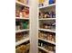 Walk-in pantry with ample shelving and well-stocked with food items at 388 Golf Crest Dr, Acworth, GA 30101