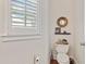 Stylish powder room with a dark vanity, wood flooring and updated fixtures at 388 Golf Crest Dr, Acworth, GA 30101