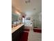 Bright bathroom with double vanity, separate tub, and glass-enclosed shower at 7699 Cabrini Pl, Fairburn, GA 30213