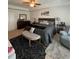 Spacious bedroom with a large bed, ceiling fan, and neutral carpet at 7699 Cabrini Pl, Fairburn, GA 30213