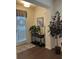 Welcoming entryway featuring hardwood floors and decorative plants at 7699 Cabrini Pl, Fairburn, GA 30213
