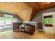Finished attic space with wood ceiling and flooring, and lots of natural light at 891 Paoli Se Ave, Atlanta, GA 30316