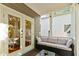 Comfortable back porch with modern furniture and outdoor view through glass doors at 891 Paoli Se Ave, Atlanta, GA 30316