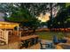 Spacious backyard with a well-equipped outdoor kitchen, a dining area, and a cozy fire pit at 891 Paoli Se Ave, Atlanta, GA 30316