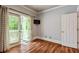 Bright room with hardwood floors leads to an outdoor balcony at 891 Paoli Se Ave, Atlanta, GA 30316